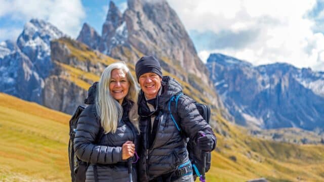 A couple hiking in the Alps.