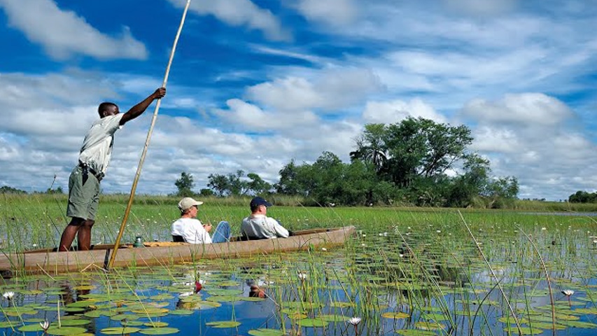Explorers on a canoe in Botswana.