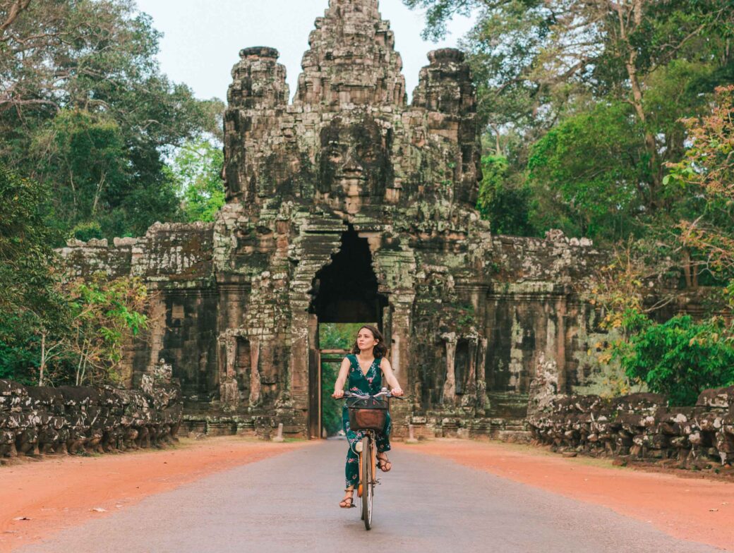 A woman biking in Cambodia.