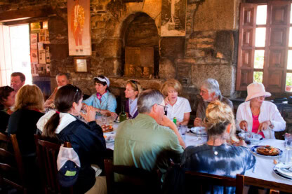 A group of travelers having dinner together.
