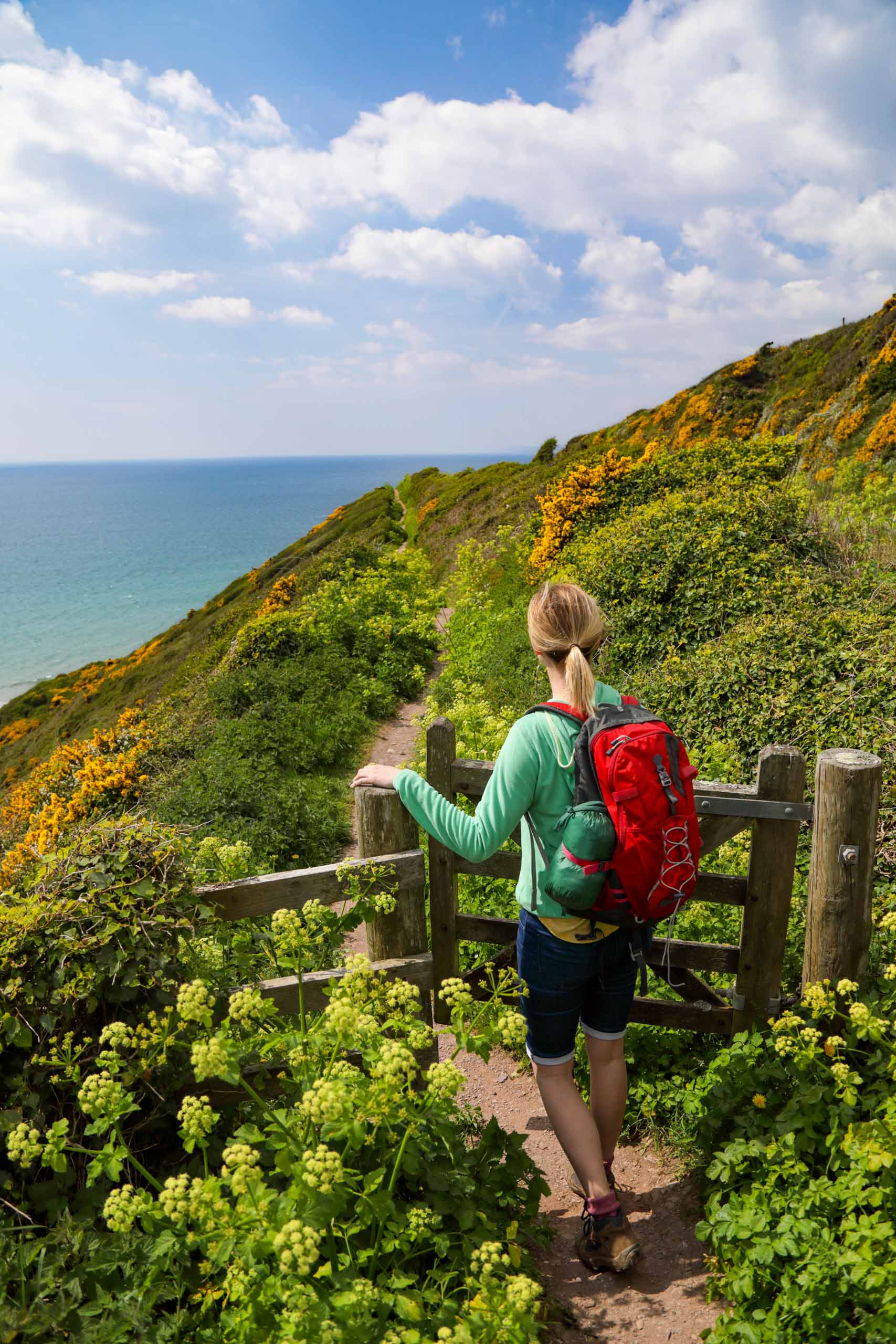 A woman on a seaside hike in England.