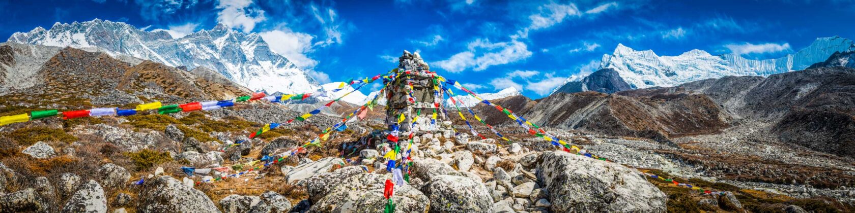 Buddhist prayer flags fluttering in the thin air of the Everest Base Camp trail.