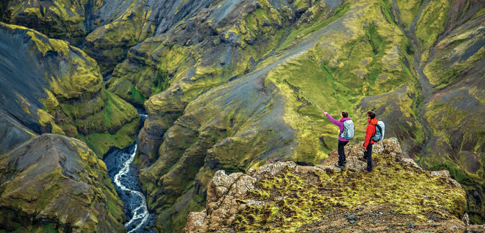 Two people hiking in Iceland.