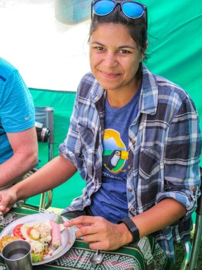 A woman enjoying a meal.