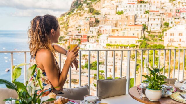 A woman having breakfast in Amalfi, Italy.