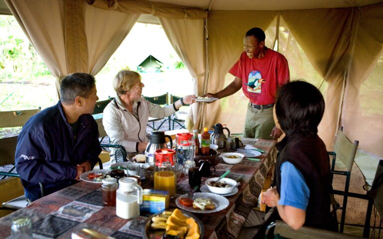 A group of people enjoying a meal in Kilimanjaro.