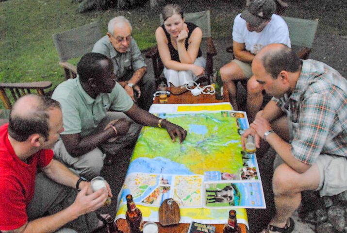 A group of travelers examining a map together.