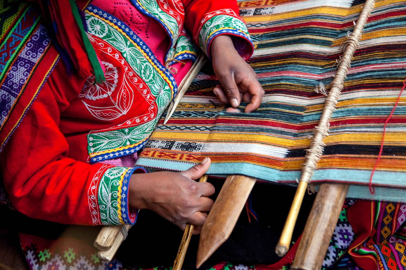A latin american person weaving.
