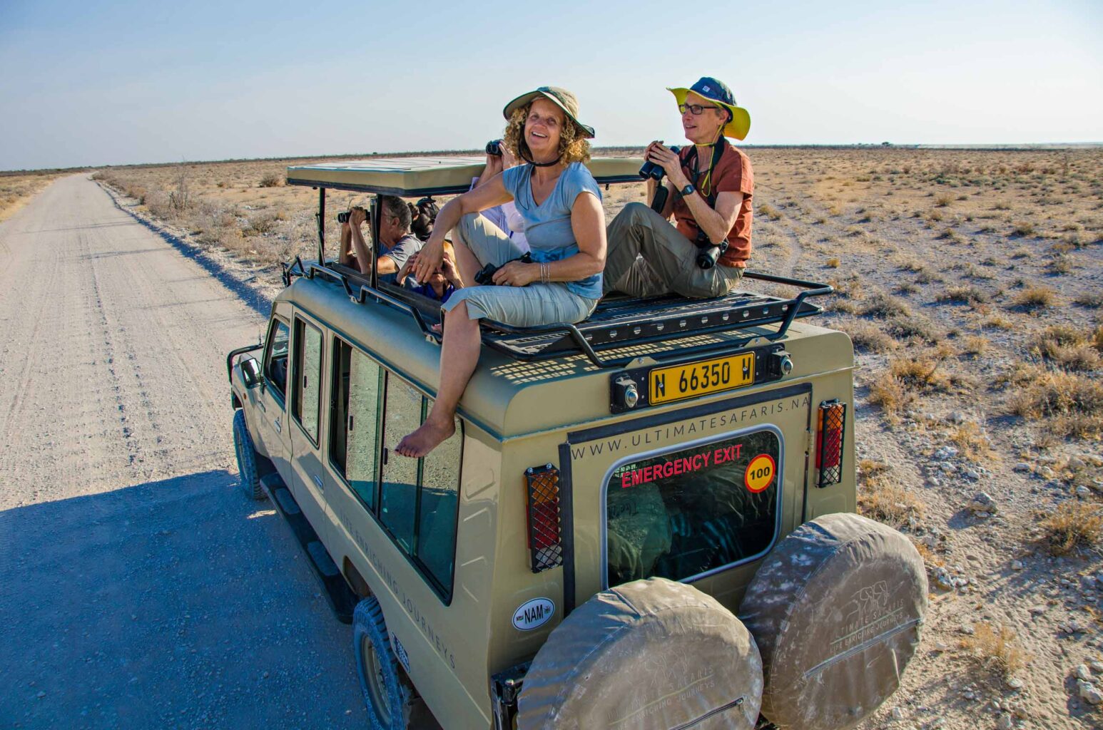A group of travelers on a safari in Namibia.