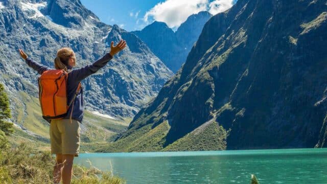 A traveler reaches Lake Marian in New Zealand.
