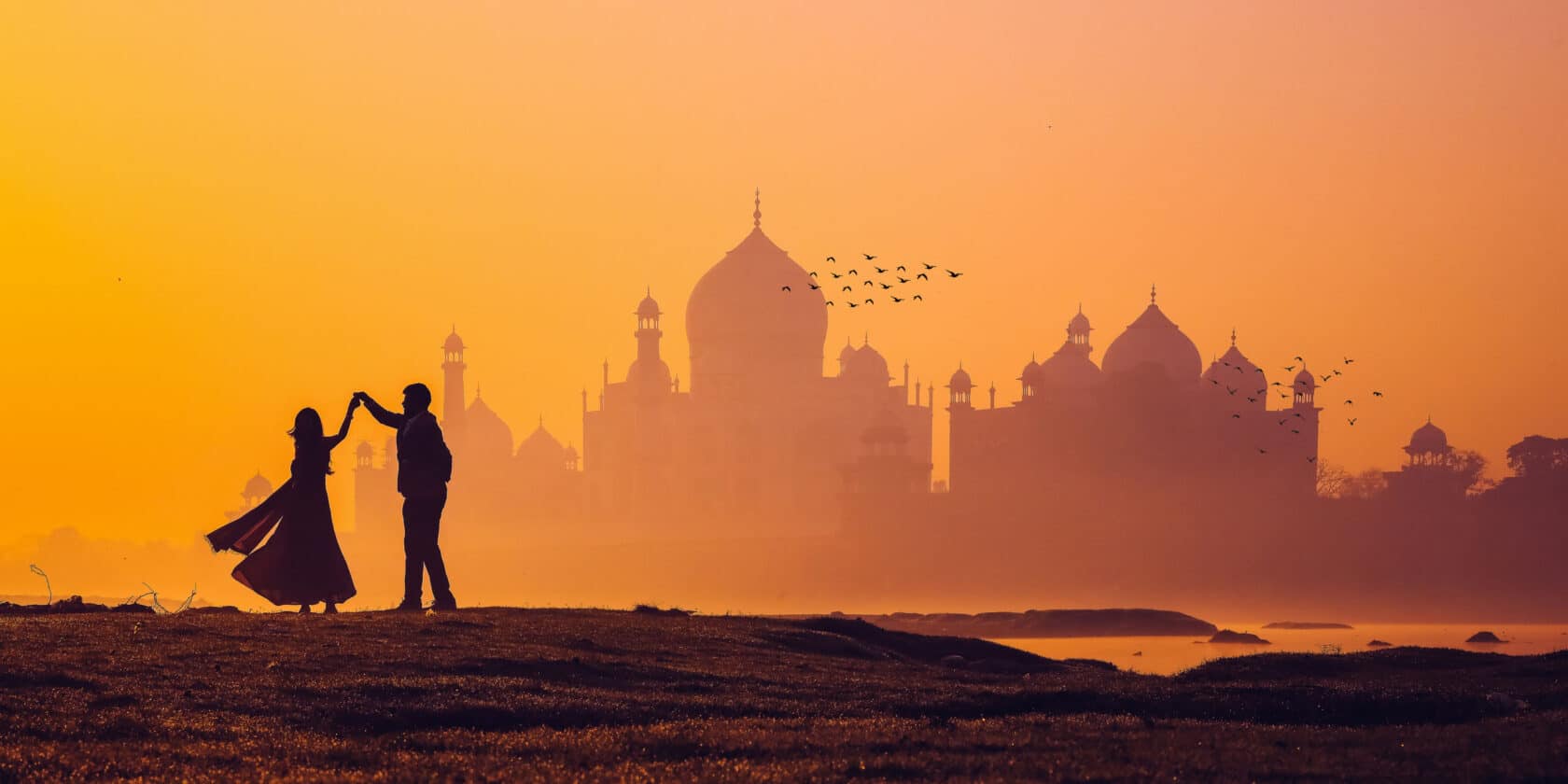 A couple dancing at sunset in India.