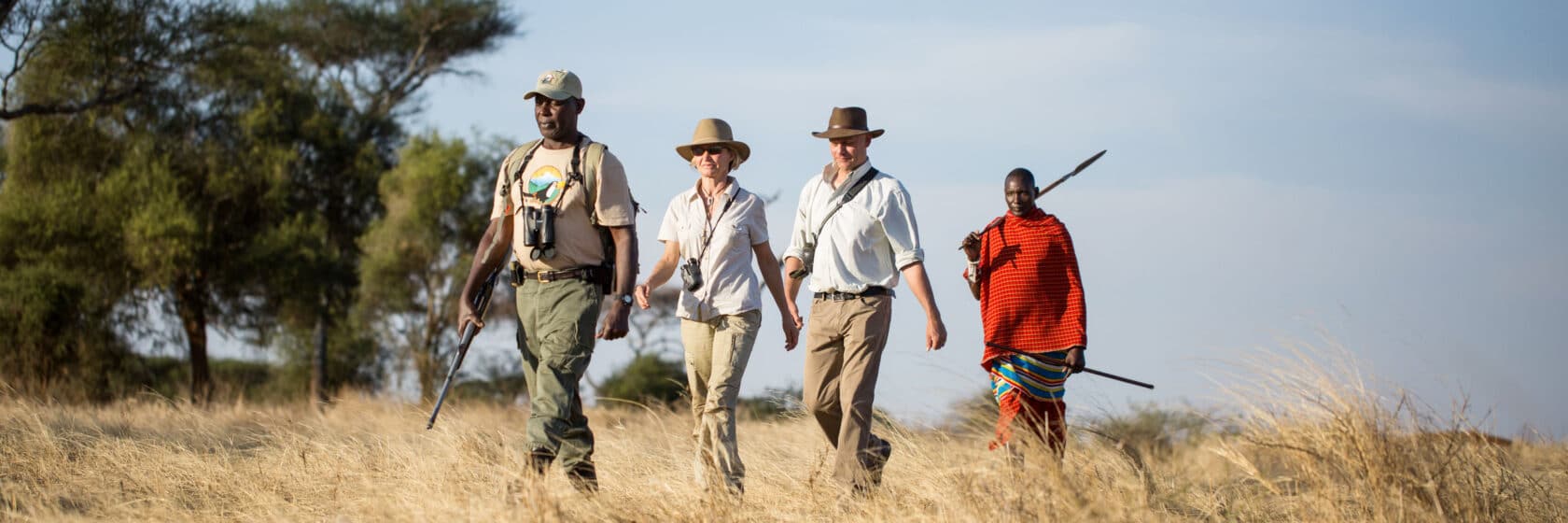 A group of people on a safari.