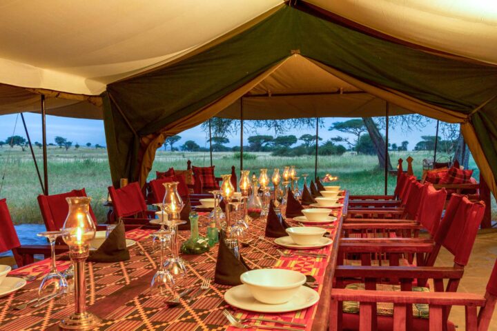 A set dining table on a campsite in Tanzania.