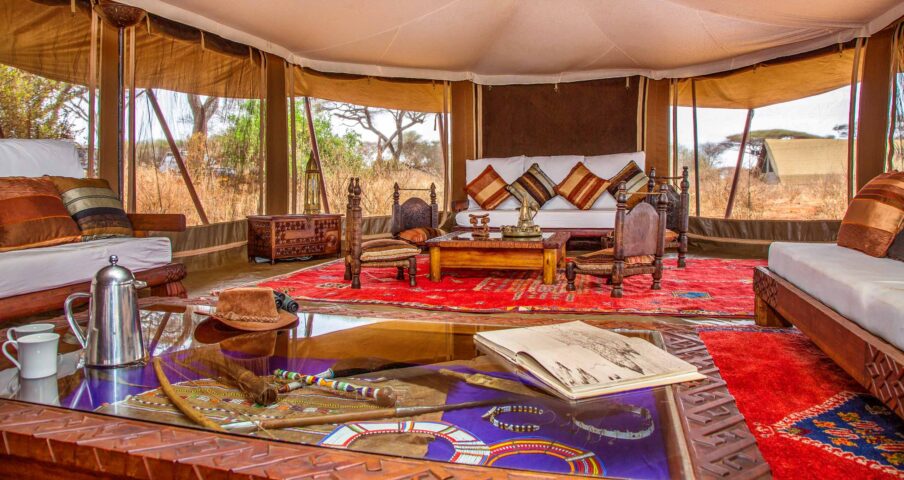 A living room in a tent on a campsite in Tanzania.