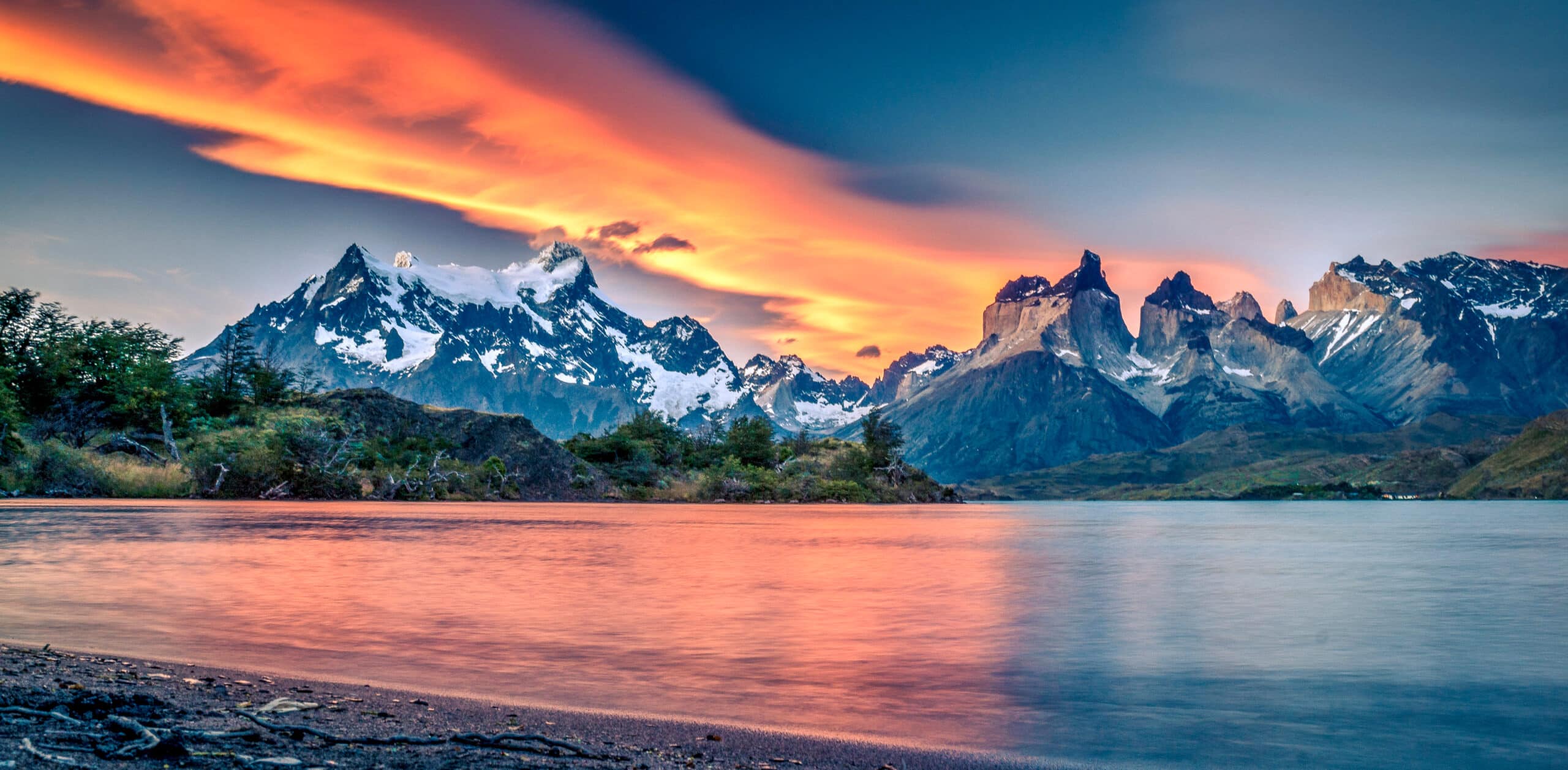 https://www.wildernesstravel.com/wp-content/uploads/2023/06/10-INPAT-sunset-lake-reflection-clouds-patagonia-torres-del-paine-national-park-scaled.jpg
