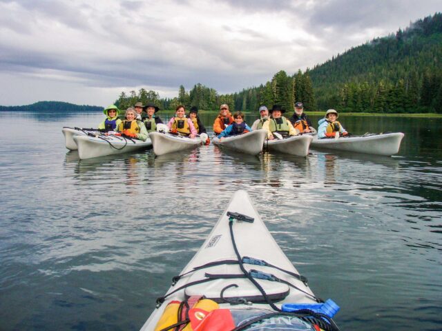 A group of kayakers in Alaska.
