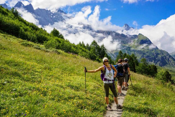 A group of hikers on a trail in the Alps.
