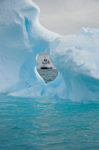 An iceberg and a boat.