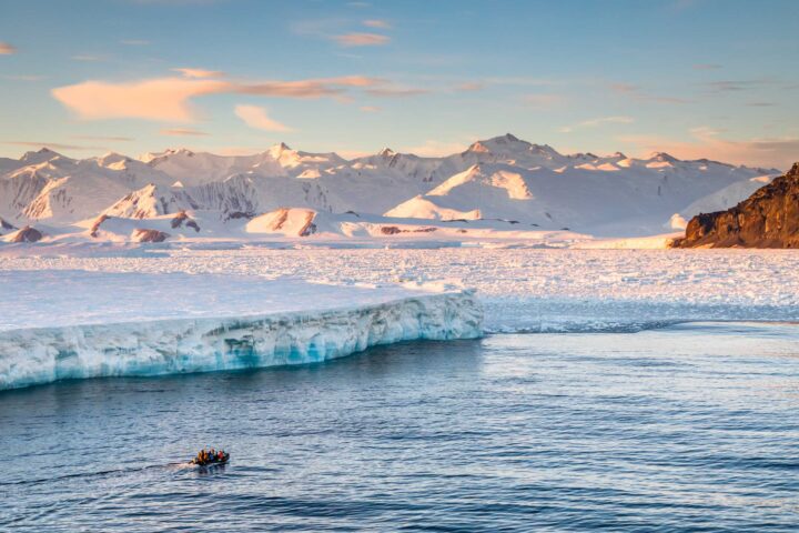 A landscape with icebergs and mountains in Antartica.
