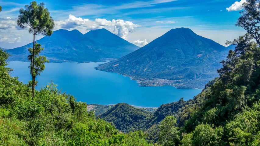 An aerial view of Lake Atitlan and surrounding scenery.