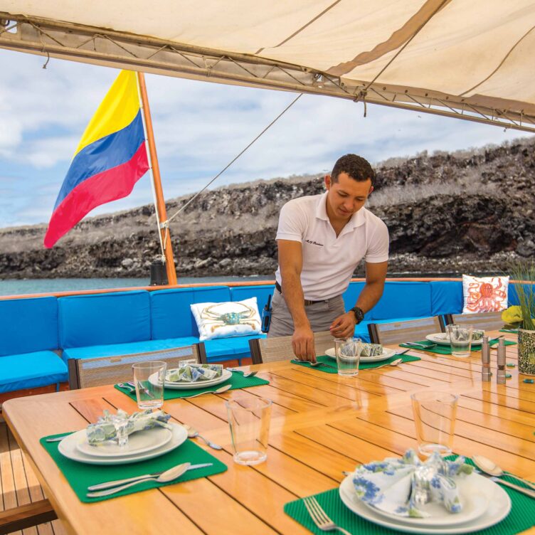 Al fresco dining area on a luxury cruise in the Galápagos Islands.
