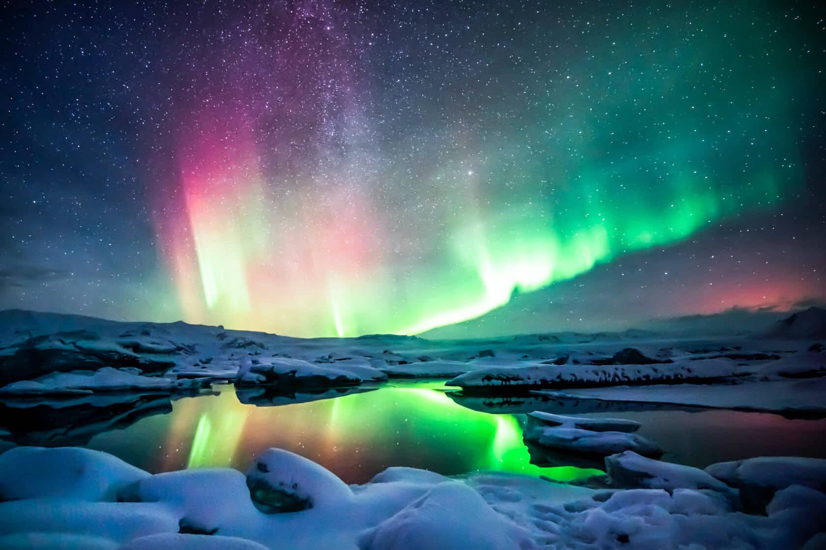 Mixed aurora dancing over the Jokulsarlon lagoon, Iceland