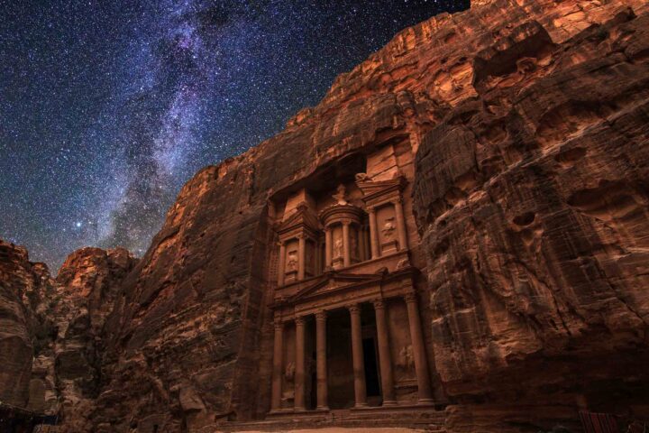 The Treasury at ancient Petra at night in Jordan.