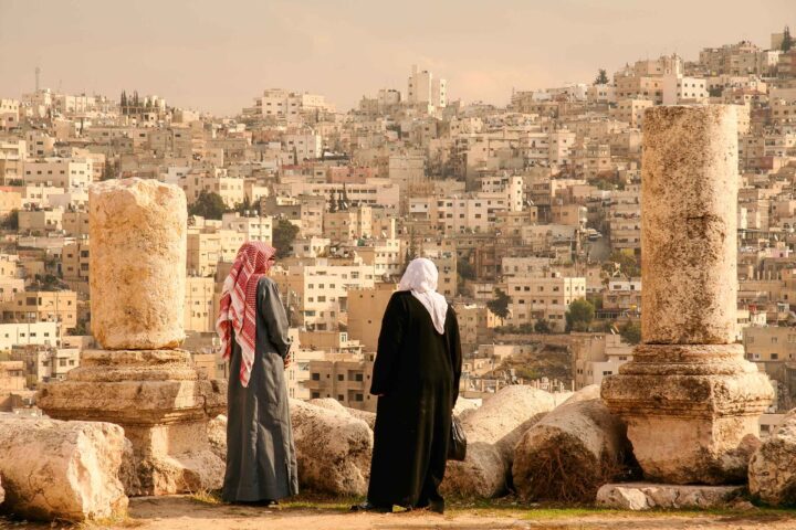 A couple looking at a view of Amman, Jordan.