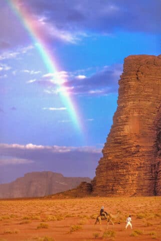 A rainbow over a desert landscape.