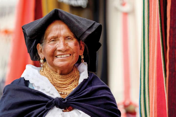 Market woman wearing a traditional Ecuadorian costume, Quito, Ecuador, South America