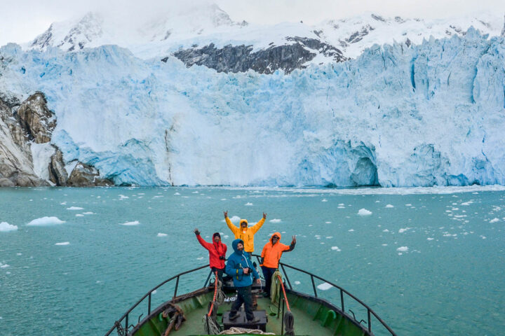 A group of tourists on an expedition on a boat in Patagonia.