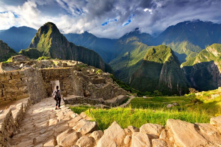 A tourist climbing steps in Peru.