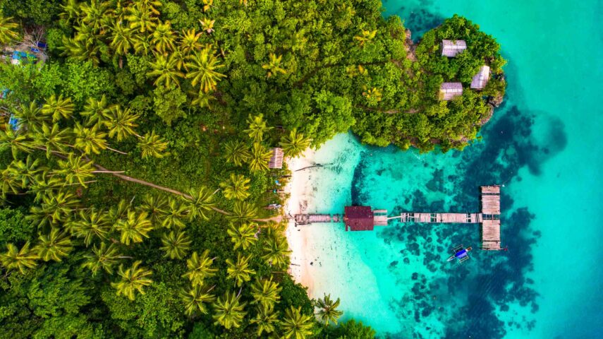 An aerial view of a small bay in Raja Ampat.