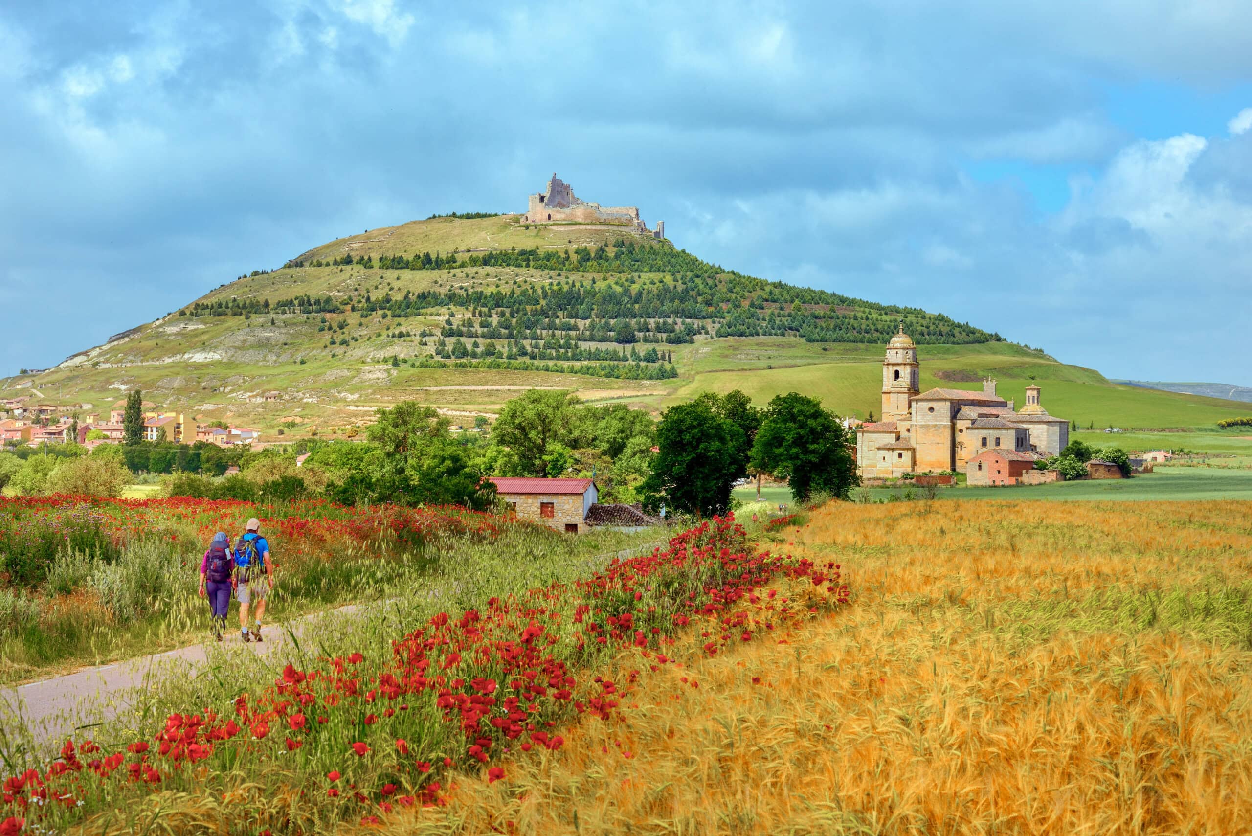 https://www.wildernesstravel.com/wp-content/uploads/2023/06/thumb-PILGRIM-camino-de-santiago-hikers-leon-spain-santa-maria-del-manzano-scaled.jpg