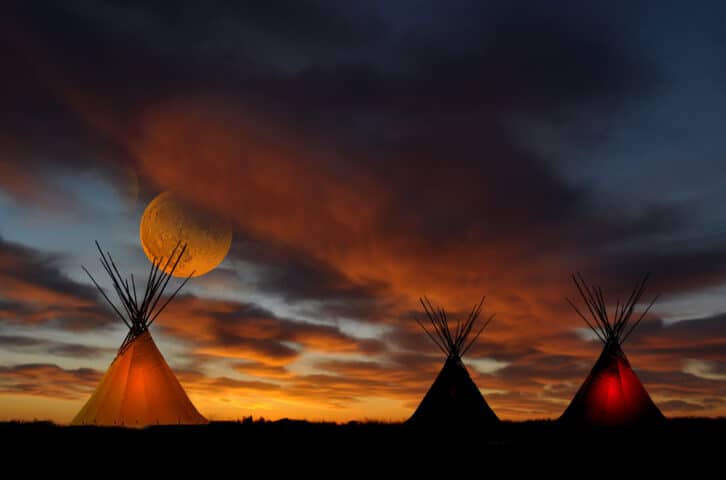 Teepees at sunset.