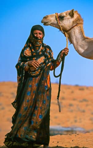 Woman with Camel Wahiba Desert Oman Middle East Arabia