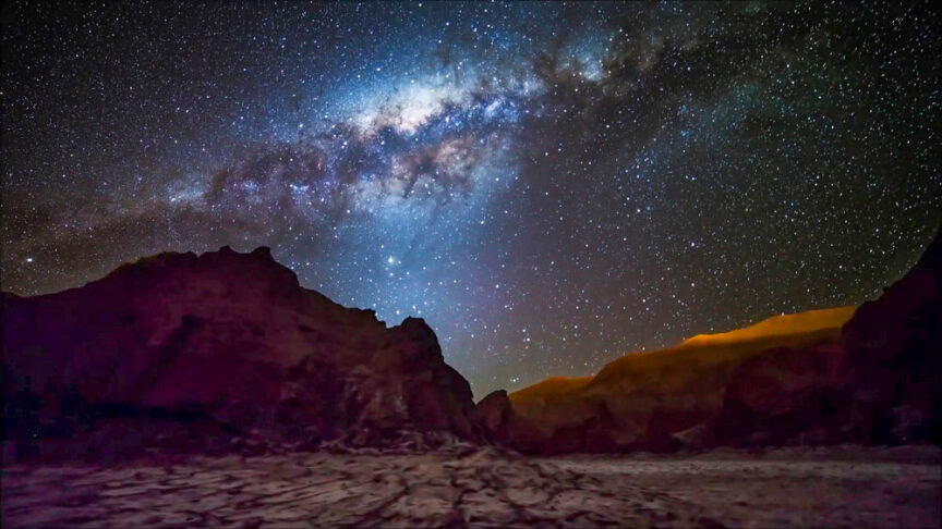 A starry sky with the Milky Way galaxy visible over a rocky mountainous landscape at night makes for one of the great places for stargazing.